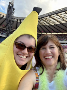  Ms. Couture and her mother embrace the energy and excitement of a Harry Styles' concert in Edinburgh. Ms. Couture dons a banana costume to enjoy the festival to its fullest. Photo courtesy of Ms. Couture. 